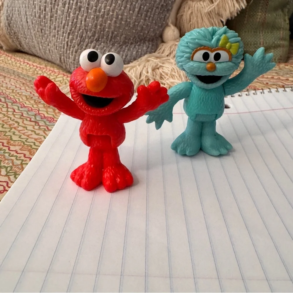 Colorful Sesame Street Neighborhood Friends and Minnie Mouse figurines